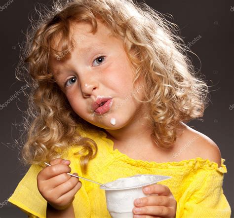 Little Girl Eating Yogurt Stock Photo By ©tatyanagl 8703938