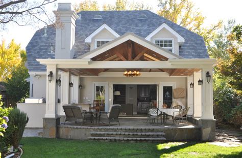 The asymmetrical roof cleverly extends on one side to make up a car port. Small covered Patio and BBQ addition in Palo Alto ...