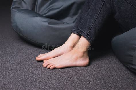 Bare Feet Of A Girl A Girl In Jeans With Bare Feet Foot And Heel