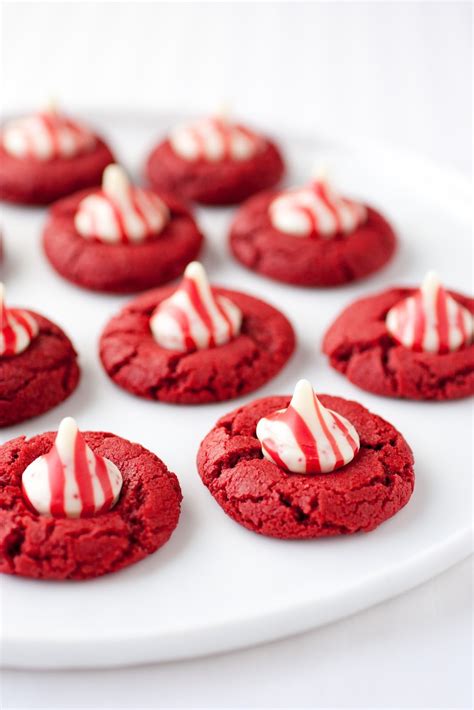 Your favorite flavor of cake is even better in cookies! Peppermint Red Velvet Cookies with Peppermint Kisses ...