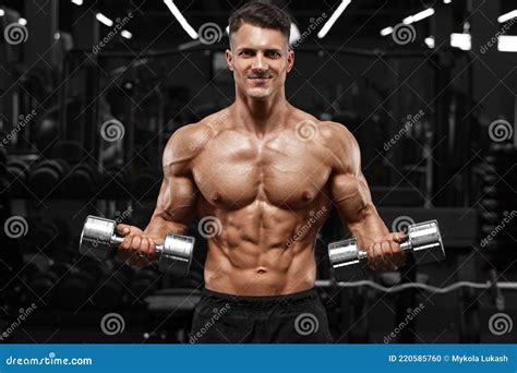 Muscular Man Working Out In Gym Doing Exercise For Biceps Strong Male