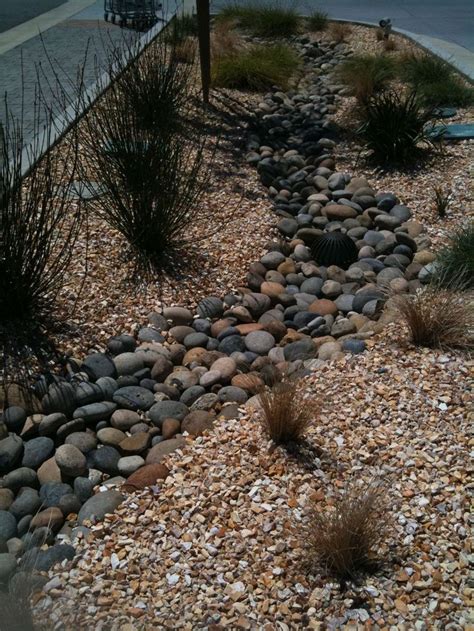 Rocks and shrubs are great for river rock landscaping. 45 best images about Garden Dry Streams on Pinterest