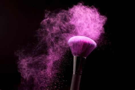 Free Photo Makeup Brush With Purple Powder Dust On Dark Background