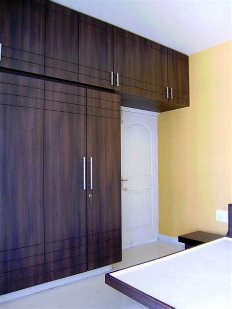 Here Are Bedroom Cupboards Made With A Dark Wood Stain Bedroom Cupboard Designs Cupboard