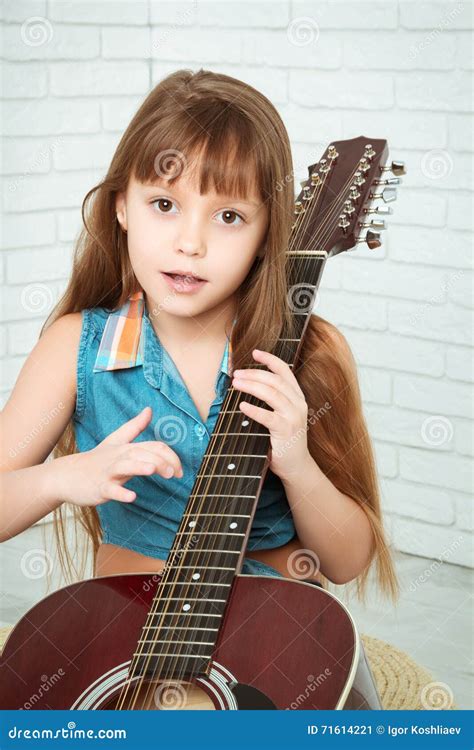 Little Girl Playing The Guitar And Sings Stock Image Image Of Musical