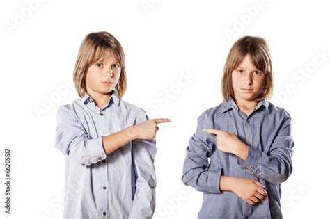 Two Twins Brothers Show The Finger At Each Other Stock Photo Adobe Stock