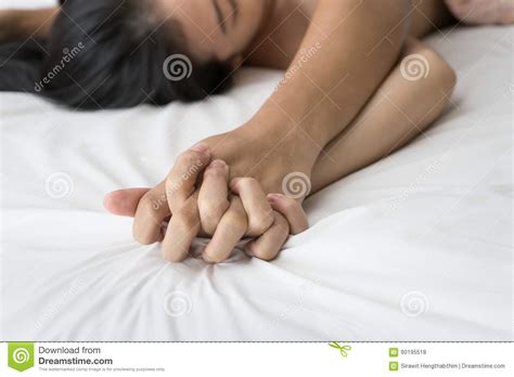Young Couple Making Love In Bed Focus On Hand Stock Photo - Image: 60195518
