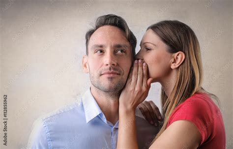 Woman Whispering Into A Mans Ear Stock Foto Adobe Stock