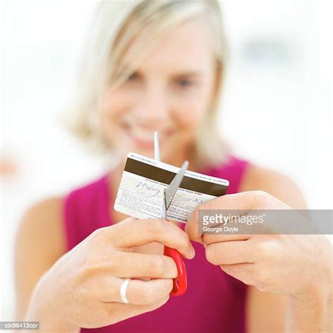 Woman Cutting Up Credit Card Photos And Premium High Res Pictures