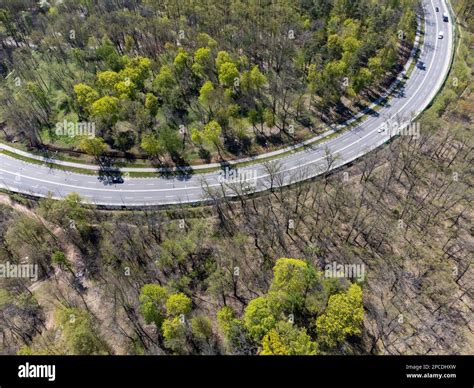Aerial Look Down View Highway Road Curve Surrounded In Forest With