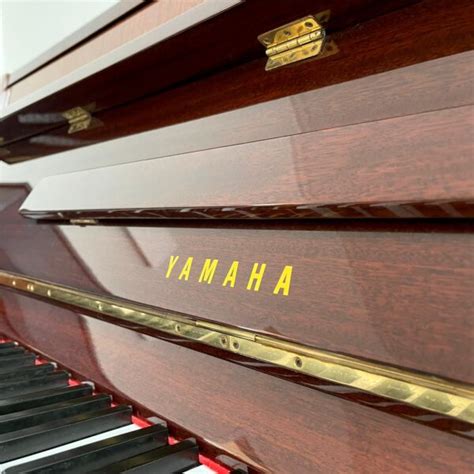 A Yamaha Upright Piano Mahogany Gloss