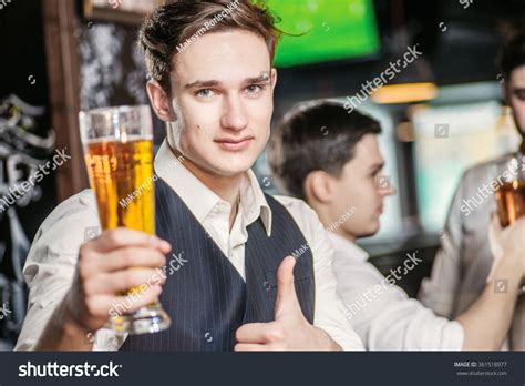 best beer three friends men drinking beer and having fun together in the bar until one of them