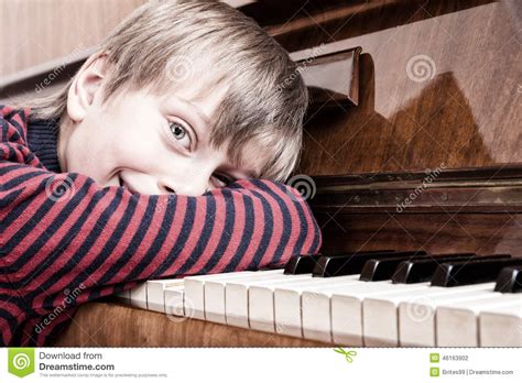 Beautiful Funny Child Musician Playing Piano Smiling Stock Photo
