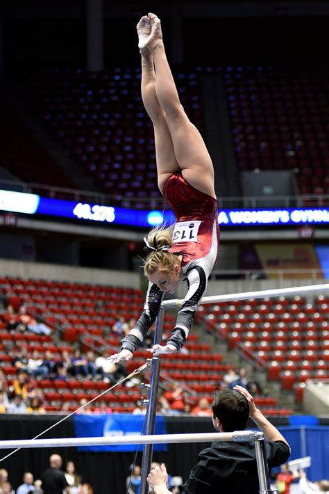 University Of Denver Gymnast Julia Ross Competes A Pak Salto On Bars At