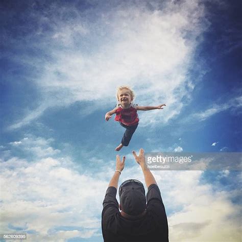 Dad Throwing Kid In Air Photos And Premium High Res Pictures Getty Images