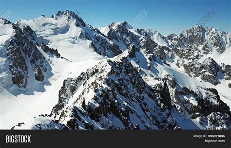 Snow Capped Mountains Image And Photo Free Trial Bigstock