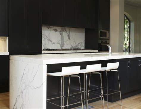 This is a lovely ivory white cabinets kitchen combined with honed black granite countertops. Black Kitchen Cabinets with White Countertops - Modern ...