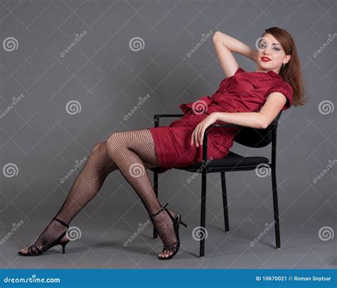 redhead girl relaxing on a chair stock image image of beauty playful 10670021