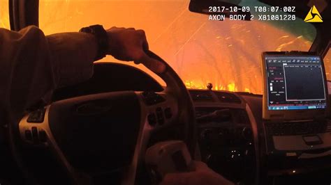 Police Camera Captures Dramatic Wildfire Evacuation