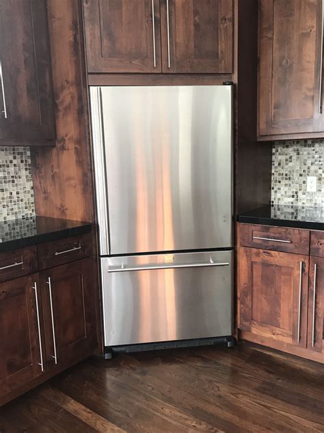 Cathedral arch = a term used when the top cabinet door has a curved shape in the panel and frame. Corner fridge | Small cottage kitchen, Kitchen remodel, Kitchen tiles design
