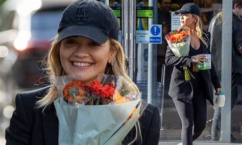 Rita Ora Carries A Bouquet Of Flowers As She Runs Errands In Tesco Express