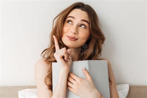 Portrait Of Cute Relaxed Woman 20s Lying In Cozy Bed After Sleep Stock