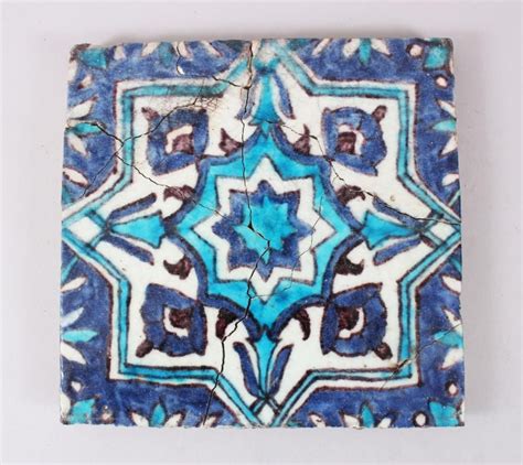 An Early Th Century Iznik Pottery Blue And White Tile A F Cm