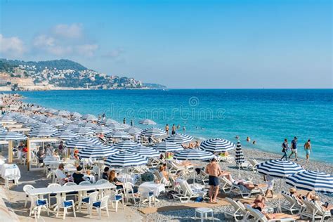 The Beautiful Nice Beach With Many Visitor Hiding In Beach Umbrellas