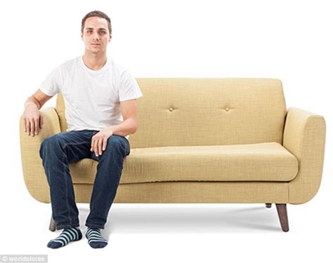 Picture Of A Gloomy Man Sitting On Couch In Front Of Tv