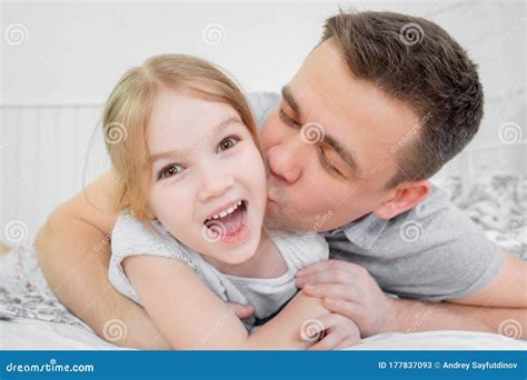 Dad Daughter Blonde Tickling And Playing On Bed Stock Image Image Of