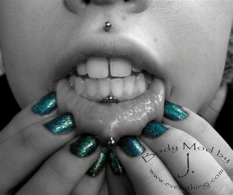 lip frenulum piercing with bead ring