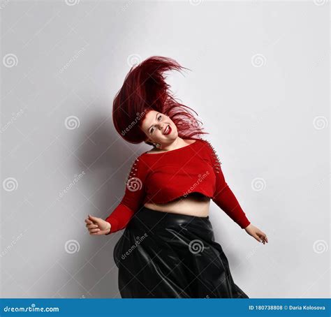Fatty Redhead Model In Red Spiked Top Black Skirt Smiling Dancing