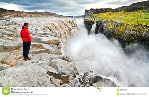 Woman Standing Near Famous Dettifoss Waterfall In