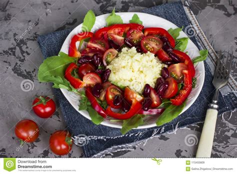 Once the couscous has cooled, transfer it to a very large serving bowl. Couscous Salad With Arugula, Cherry Tomatoes, Pepper And ...