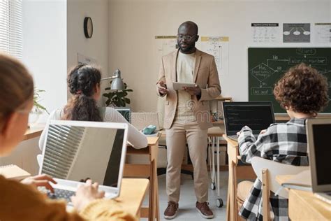 Teacher Talking To Children At Lesson Stock Photo Image Of Indoors