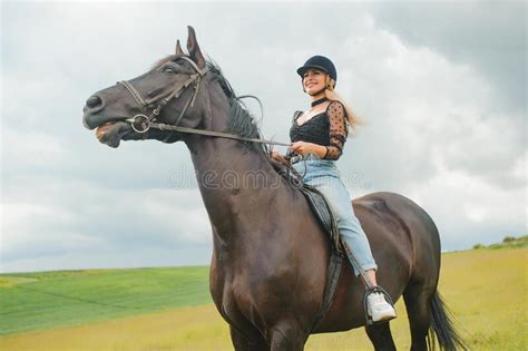 Young Woman Riding A Horse On The Green Field Stock Image Image Of