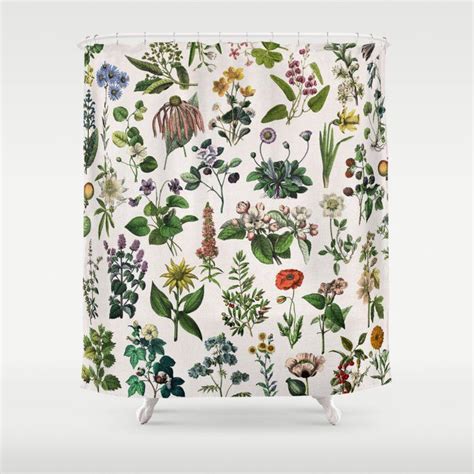 A Shower Curtain With Various Flowers And Leaves Printed On The Front