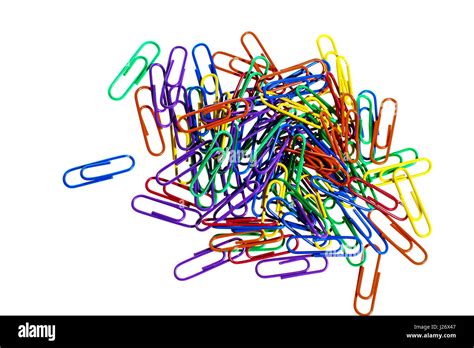 Multi Coloured Heap Of Metal Paper Clips Isolated On A White Background