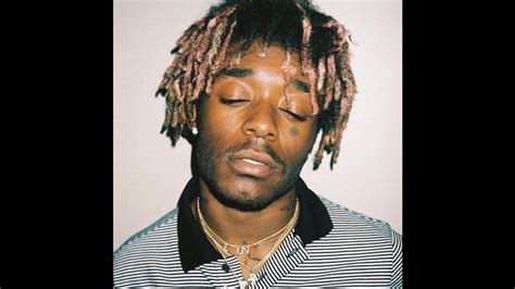 Lil Uzi Vert Is Closing Eyes And Wearing Black And White Striped Tshirt