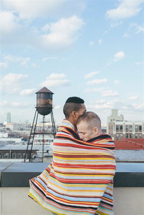 Portrait Of Loving Interracial Gay Male Couple Embracing On A Brooklyn
