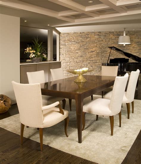 Modern Dining Room With Clean Lines And Neutral Stone Wall Dining Room