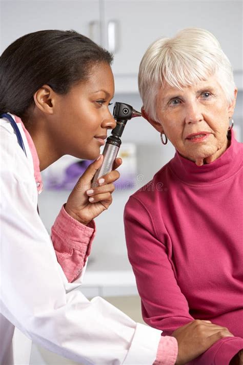 Doctor Examining Male Patient S Ears Stock Image Image Of Patient