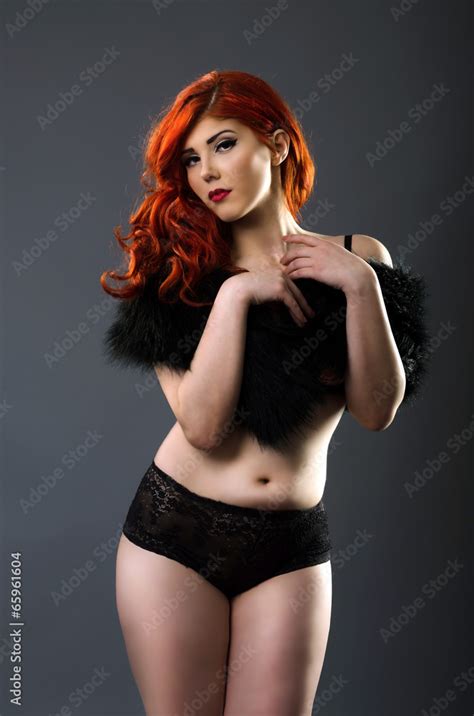 Curvy Redhead In Sexy Lingerie Isolated Over Gray Background Stock