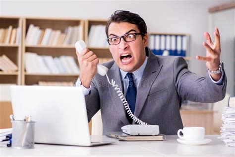 The Angry Businessman With Too Much Work In Office Stock Photo Image