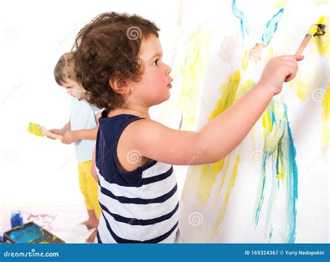 Three Children Paint With Brushes And Paints Stock Image Image Of