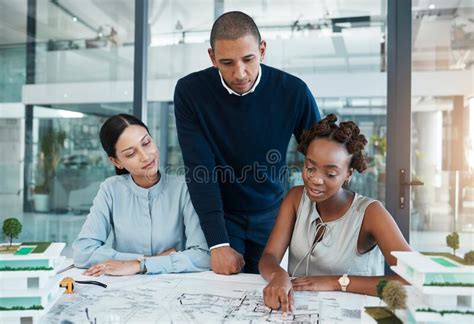 Architect Engineering Blueprint And Industrial Designer Working On