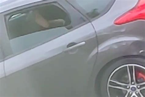 Moment Randy Couple Are Caught Having Vigorous Sex On Back Seat Of Car
