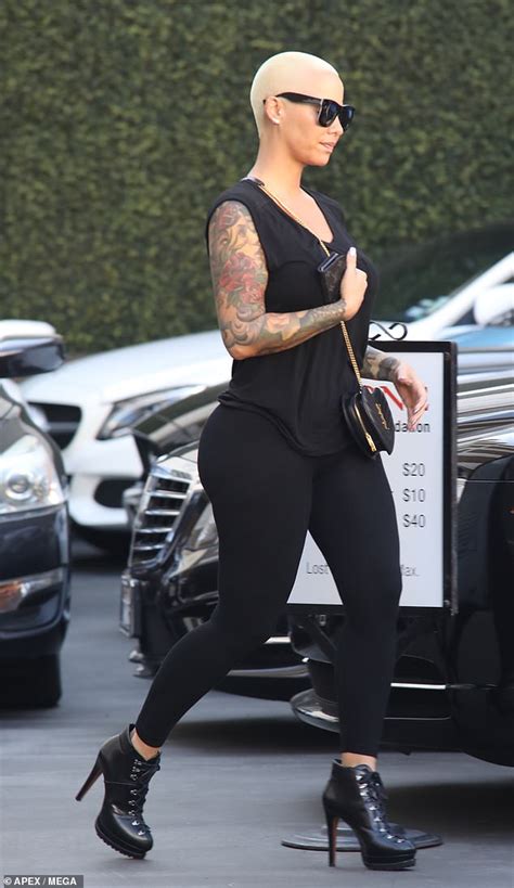 Amber Rose Puts Her Curves On Display In Black Tank Top And Matching