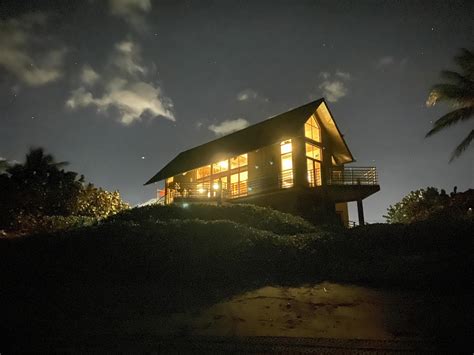 Vacation home in night mode. Taken from the very dark beach. Another