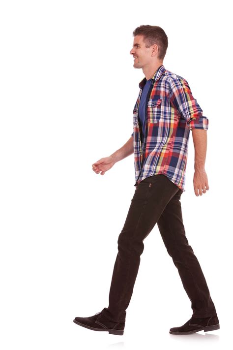 15333384 Side View Of A Young Casual Man Walking On A White